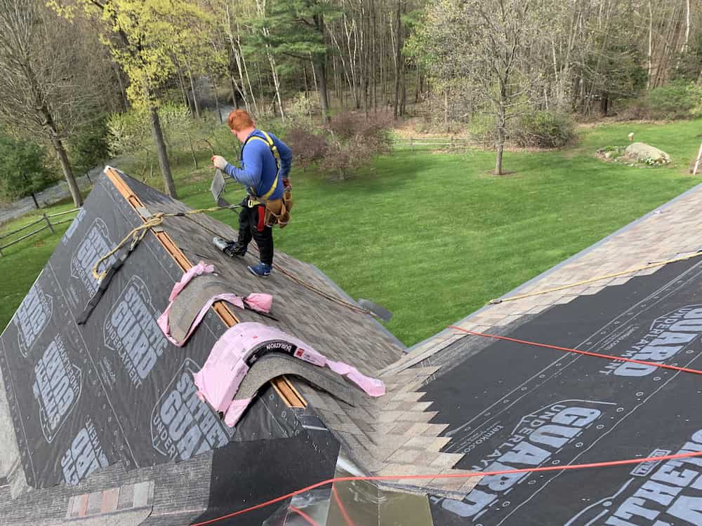 Professional wind damage roof repair in progress - Albany NY
