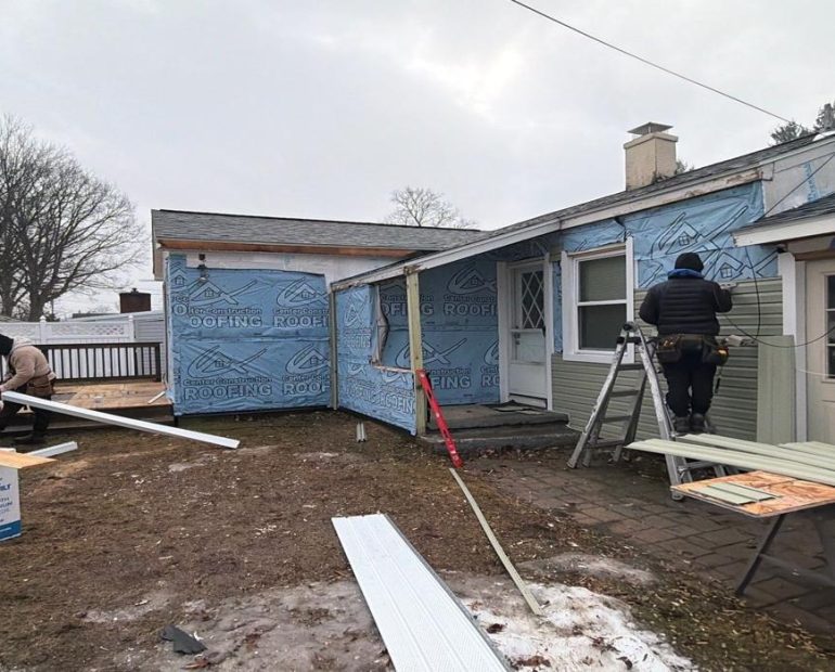 Professional residential roofing installation in progress by experienced contractors