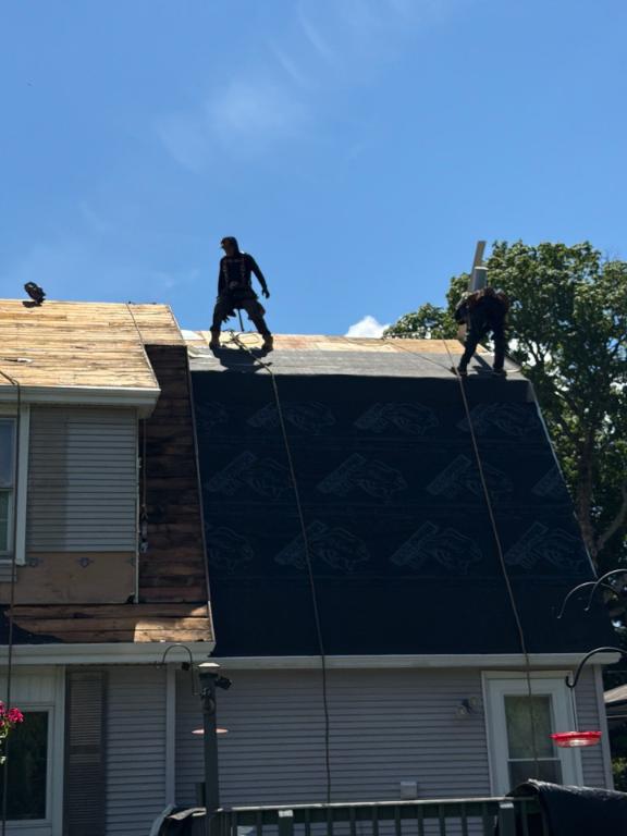 Roofing contractor working on a home in Old Chatham NY