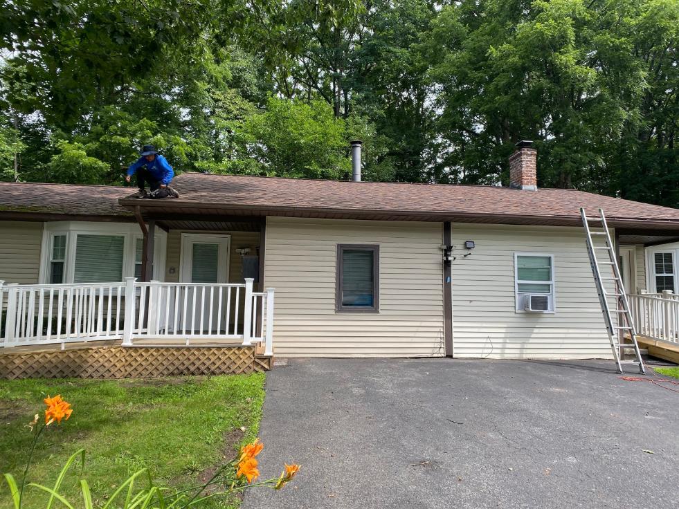 Professional roof eave ventilation upgrades completed on a residential asphalt shingle roof by Center Construction Roofing.
