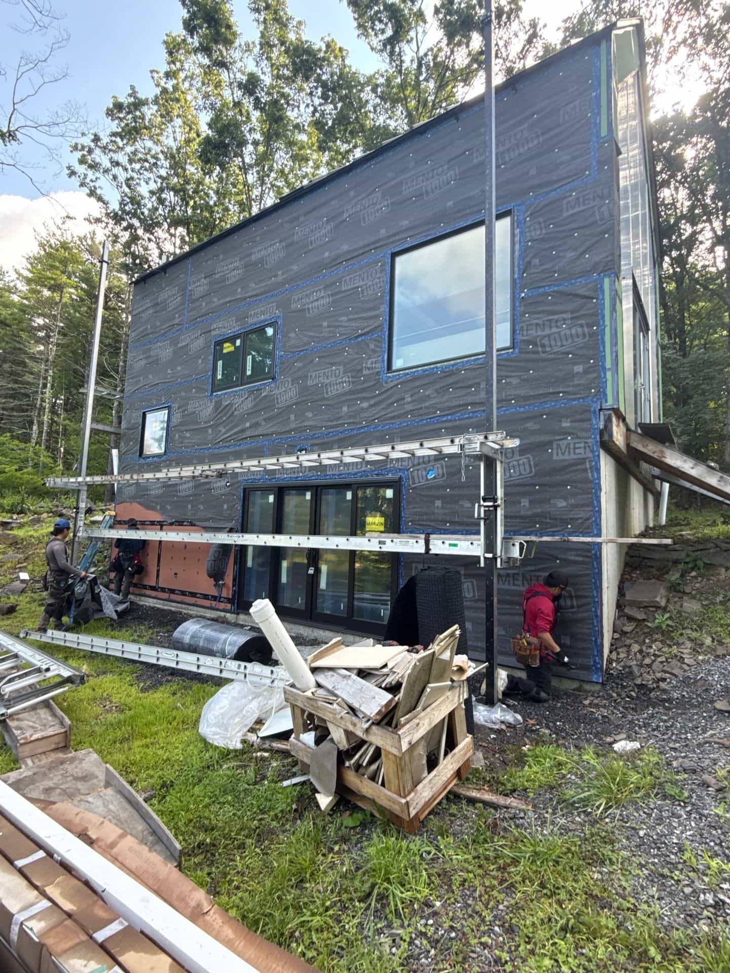 Why Weather Resistive Barriers Matter Before Siding Installation weather resistive barrier before siding installation Weather-resistive barrier installed on a residential home before new siding installation by Center Construction Roofing.
