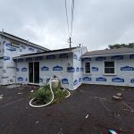 Home wrapped during roof and siding replacement at the same time