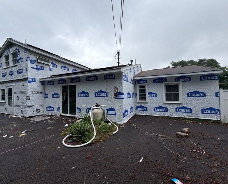 Home wrapped during roof and siding replacement at the same time