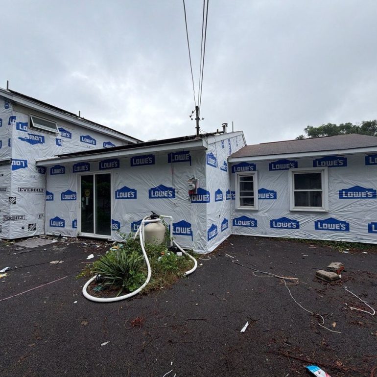 Home wrapped during roof and siding replacement at the same time