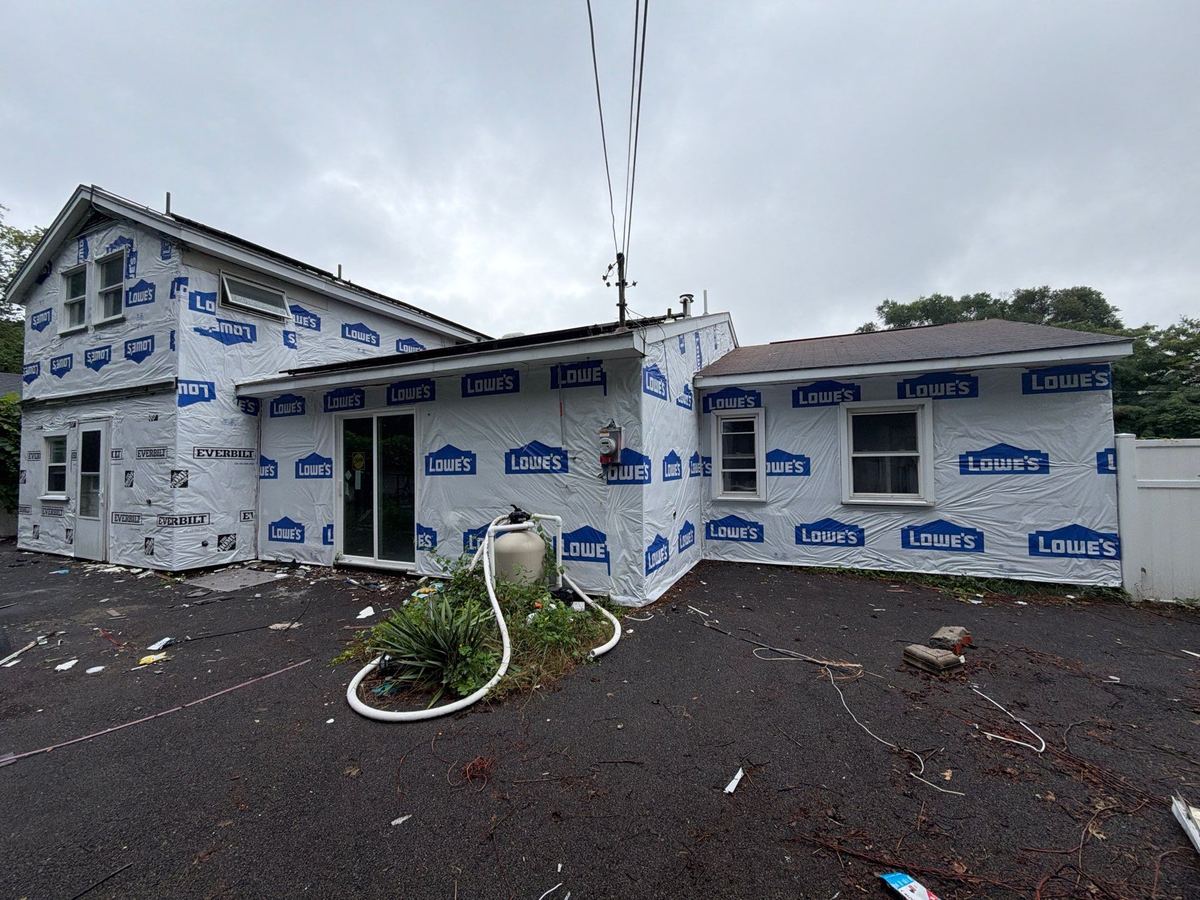 Home wrapped during roof and siding replacement at the same time