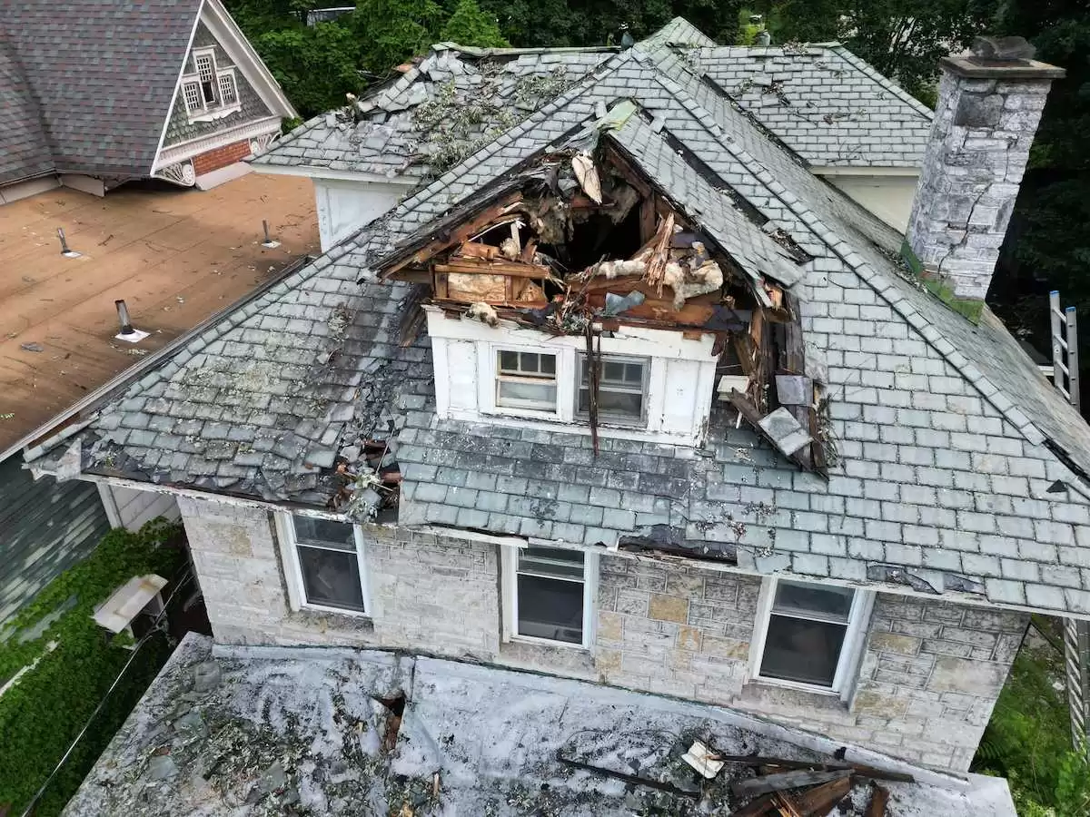 Before and after storm damage repair - residential roof in Capital Region