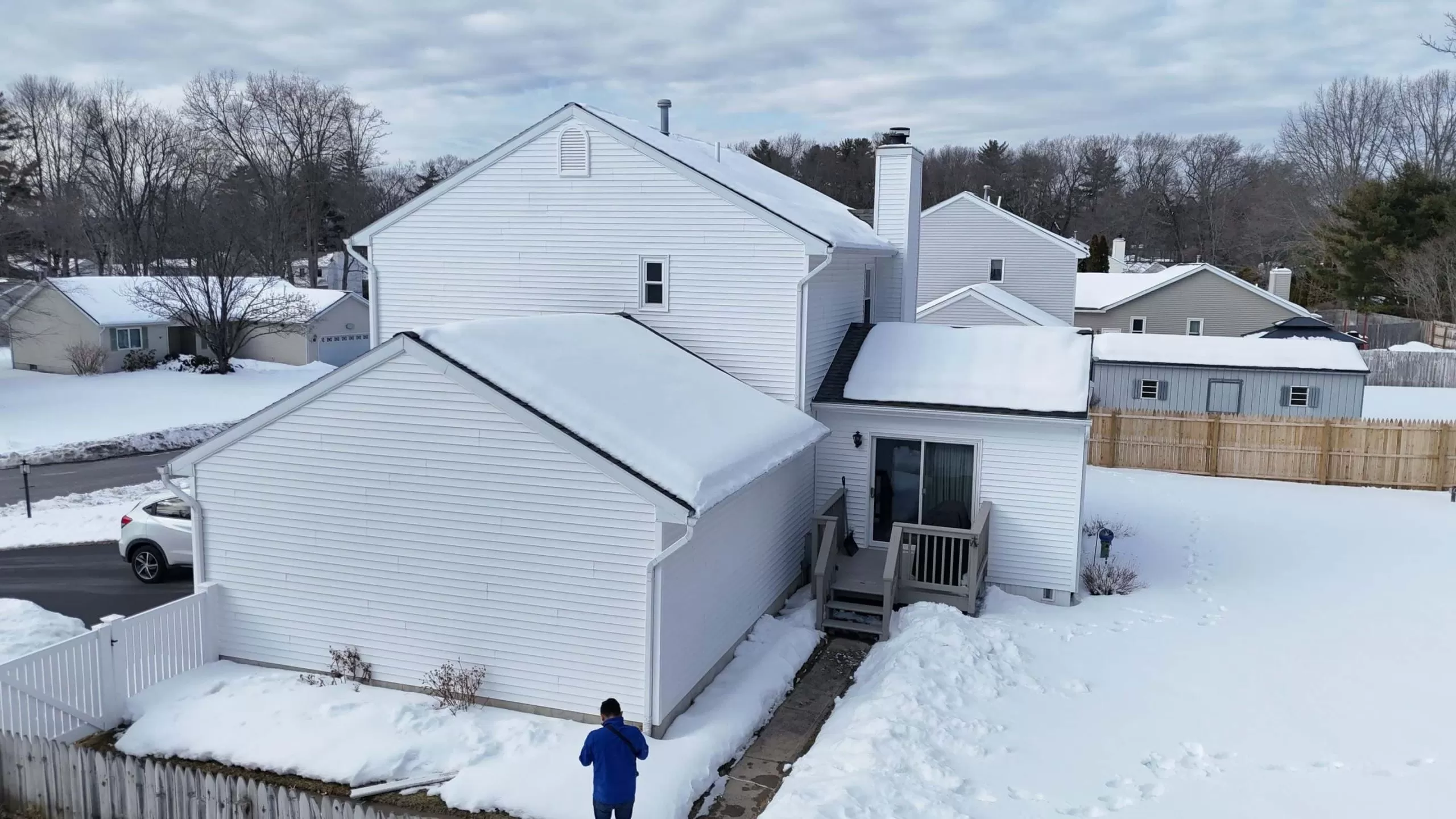 Metal Roofing Benefits: Why Many Homeowners Choose It in 2026 metal roofing benefits homeowners 2026 scaled Snow covered residential home with sloped roof showcasing why homeowners choose durable metal roofing in 2026