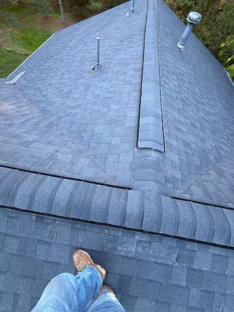 Roof Repair vs Roof Replacement: Which Option Is Better? roof repair vs roof replacement new shingle roof New asphalt shingle roof installation with synthetic underlayment on a residential home