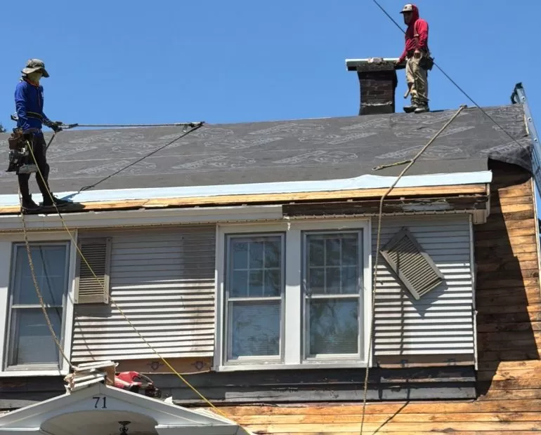 Why Roof Edge Protection Matters During Roof Replacement roof edge protection during roof replacement Roofing crew installing roof edge protection and synthetic underlayment during a residential roof replacement by Center Construction Roofing.