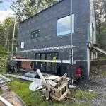 Weather-resistive barrier installed on a residential home before new siding installation by Center Construction Roofing.