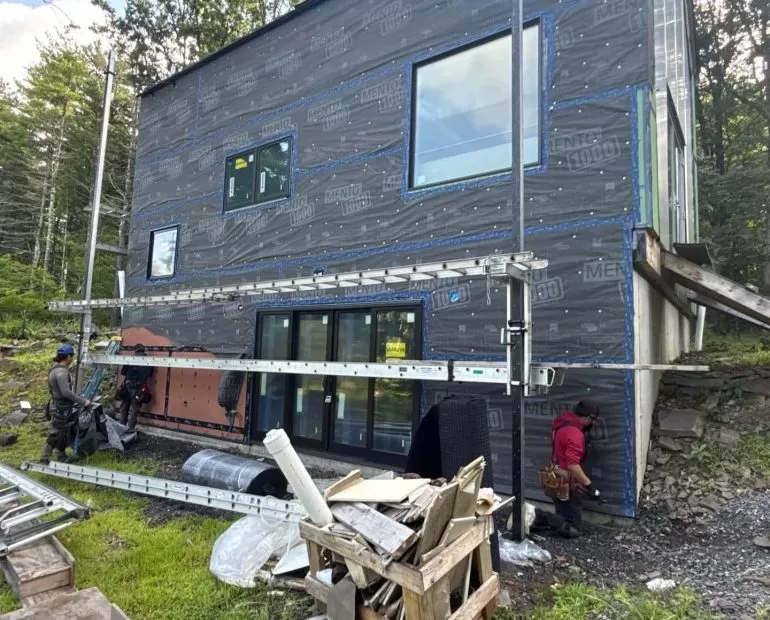 Why Weather Resistive Barriers Matter Before Siding Installation weather resistive barrier before siding installation Weather-resistive barrier installed on a residential home before new siding installation by Center Construction Roofing.