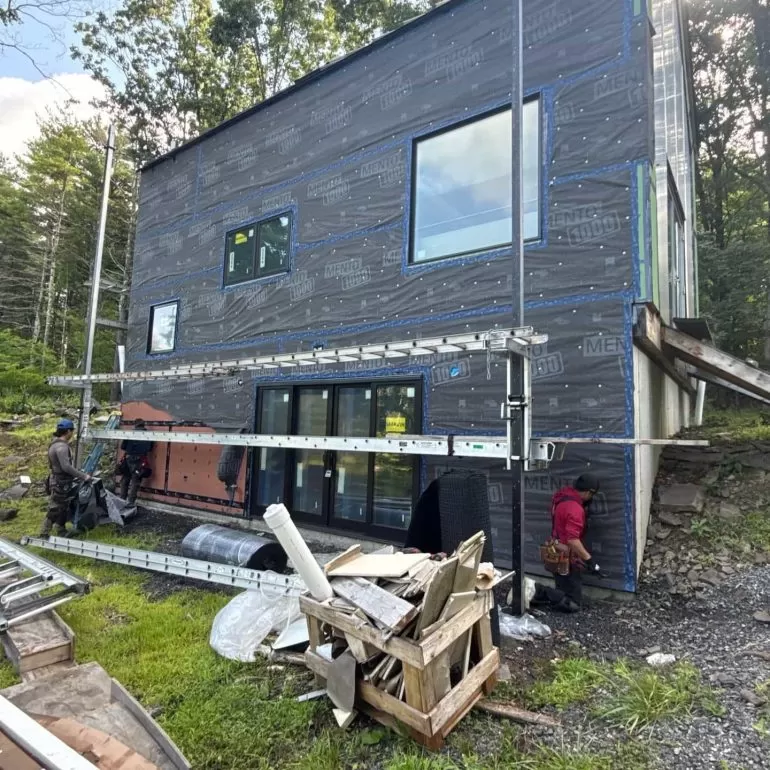 Why Weather Resistive Barriers Matter Before Siding Installation weather resistive barrier before siding installation Weather-resistive barrier installed on a residential home before new siding installation by Center Construction Roofing.