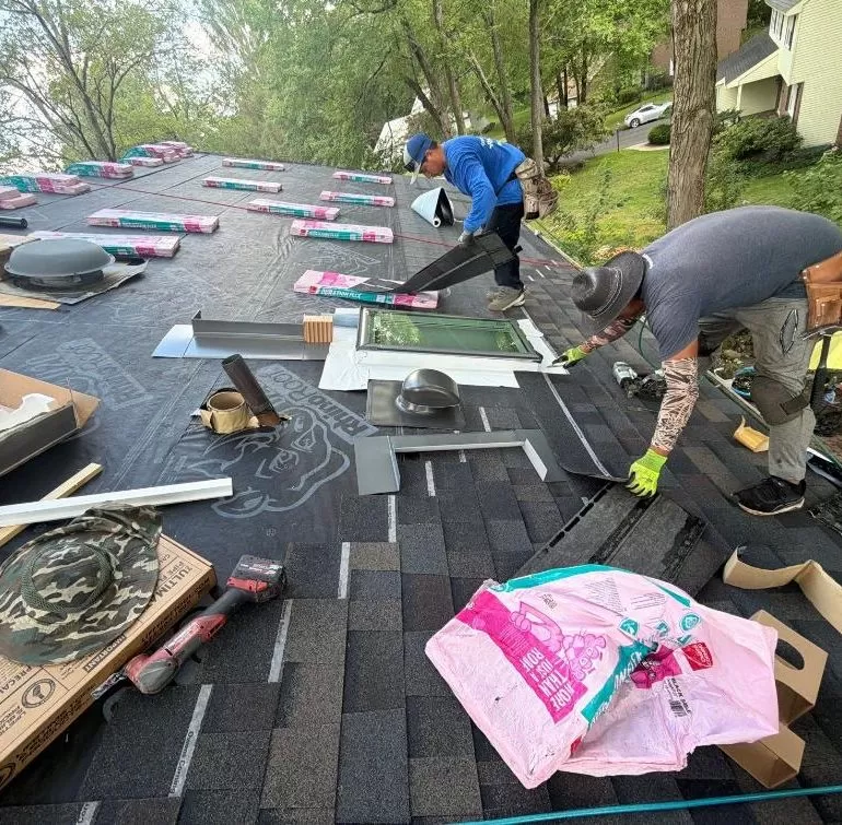Asphalt Shingle Roof Underlayment Installation: Why It Matters Before New Shingles asphalt shingle roof underlayment installation Professional roofers installing synthetic underlayment before asphalt shingles during a residential roof replacement.